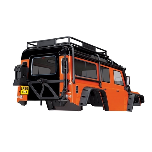 Traxxas TRX-4 Land Rover Defender Adventure con carrocería naranja con ExoCage, guardabarros interiores, depósitos de combustible y gato