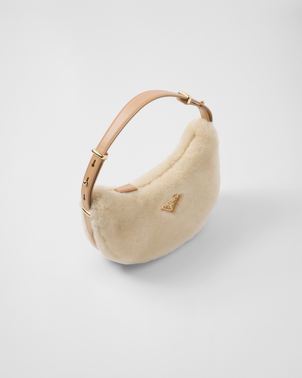 Prada Arqué shearling and leather shoulder bag
